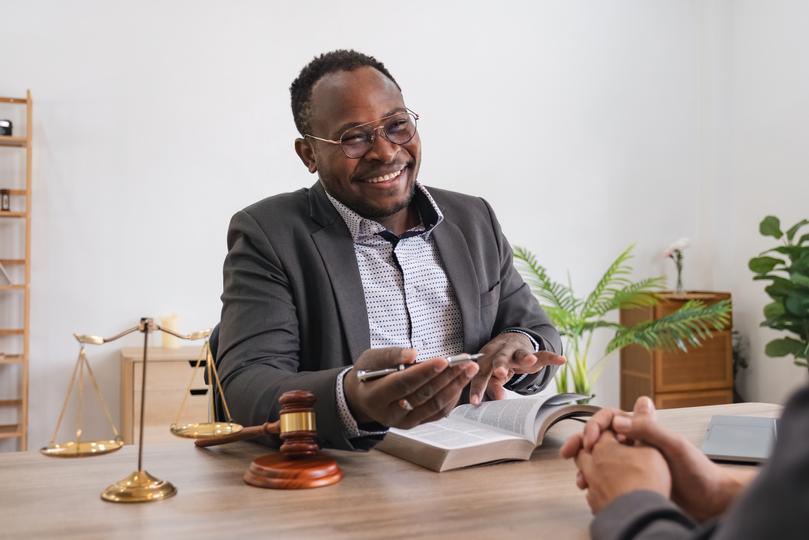 Image of a solicitor consulting with a client about medical negligence