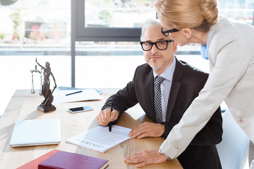 A team of professional solicitors discussing property dispute resolution plans