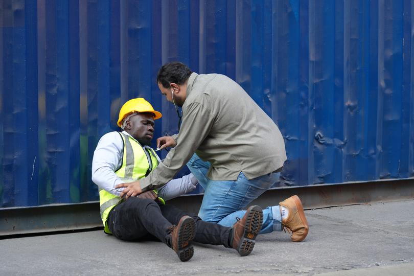 Legal professional discussing a workplace injury case with a client