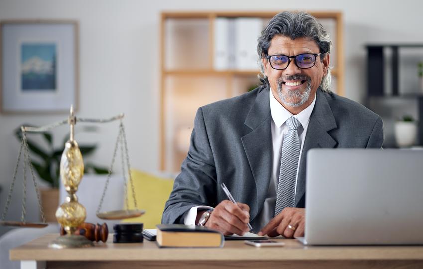 Satisfied client shaking hands with an employment lawyer after successful case resolution