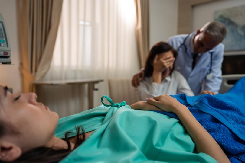 Professional solicitor advising a client on a medical negligence case