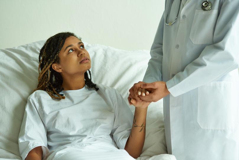 Professional solicitor advising a client on a medical negligence case
