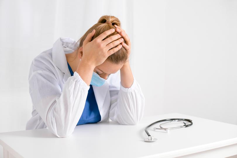 Professional solicitor advising a client on a medical negligence case