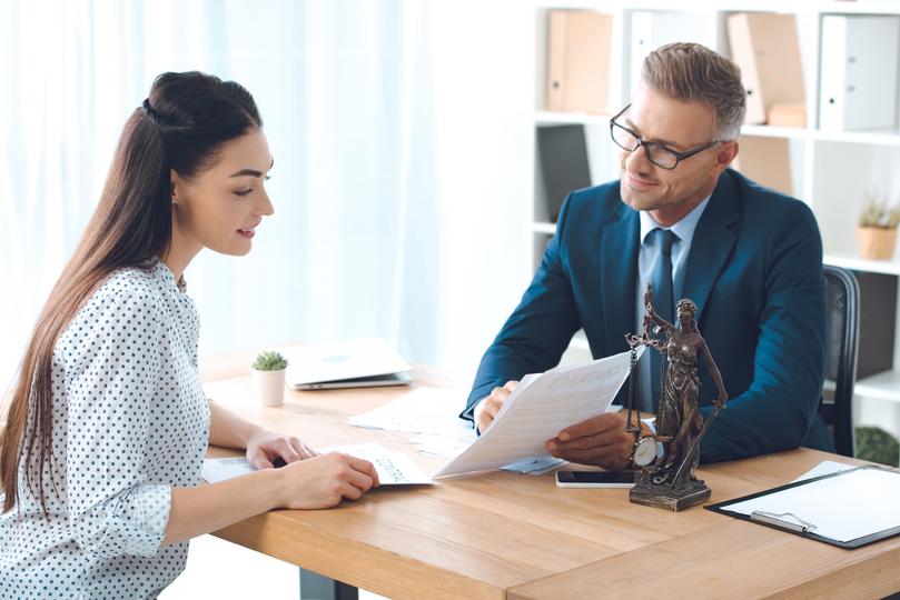 Client and solicitor reviewing a legal document