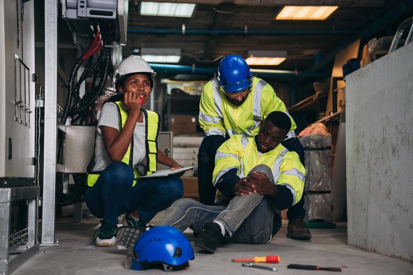Legal professional discussing a workplace injury case with a client